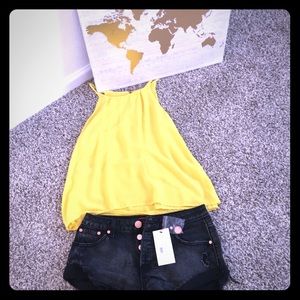 Vintage black distressed rolled button jean shorts